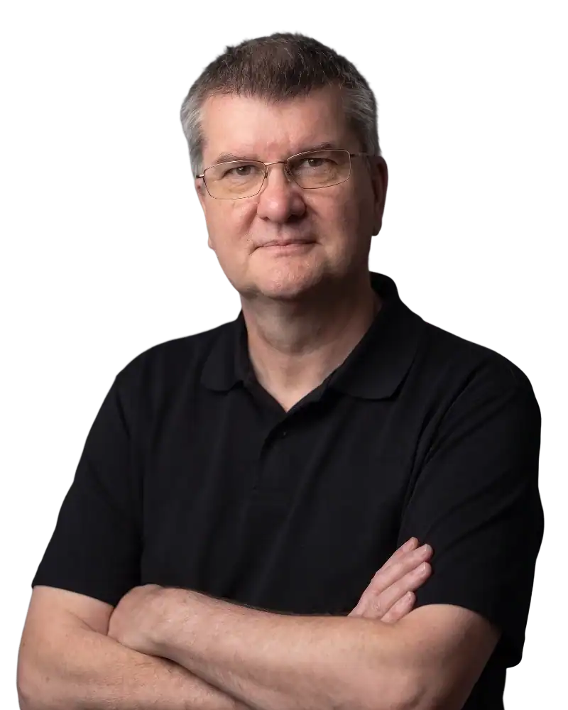 Middle-aged man with glasses and folded arms